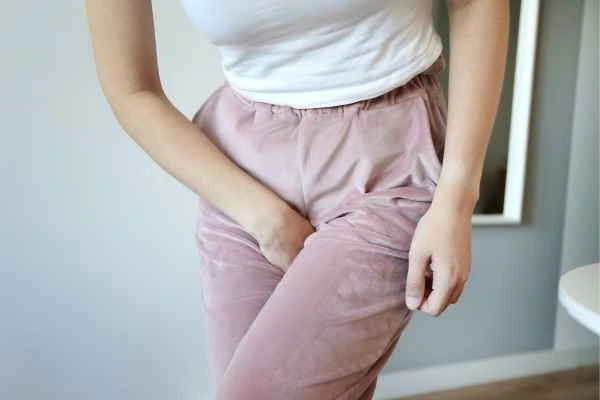 older woman running to the toilet because of urinary incontinence Lower Place