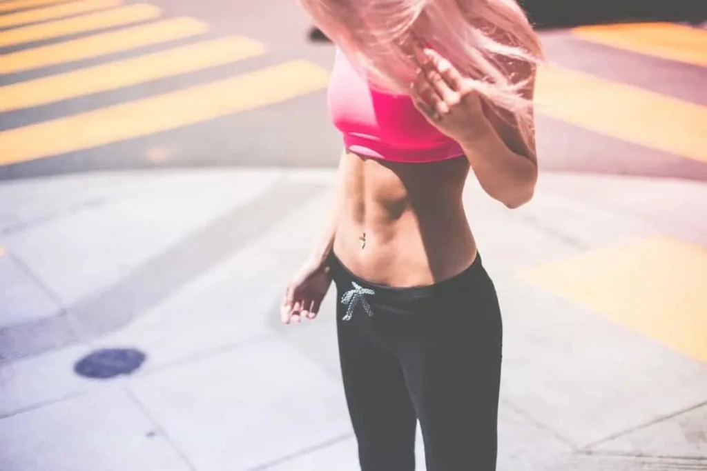 Woman with toned stomach after LA-EMS Body Sculpting Treatment Lower Place